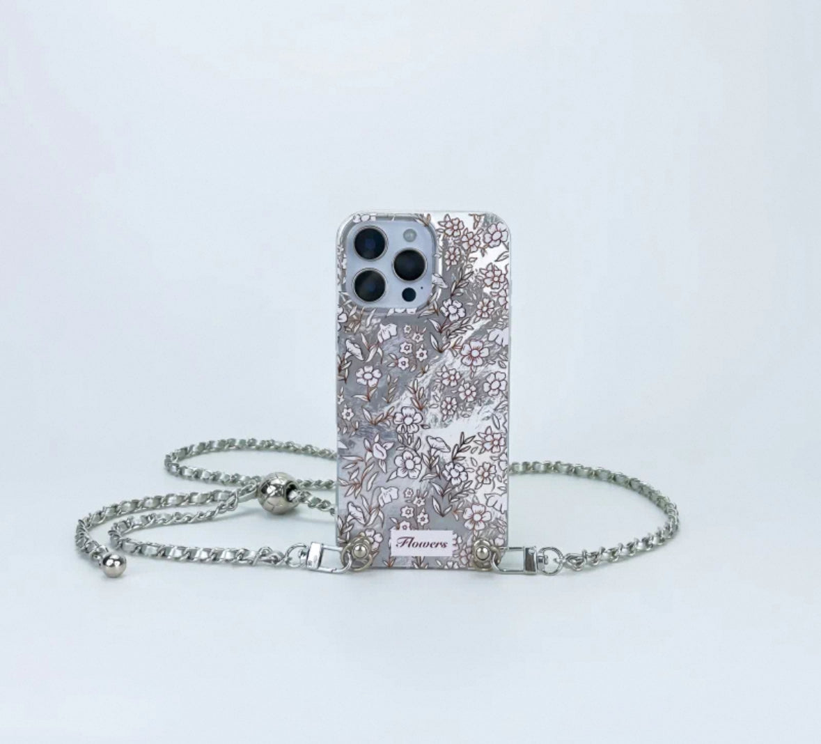 高級感溢れる銀色の一面に小さな花柄が施されたスマホケース (Luxurious silver phone case featuring an all - over pattern of small blossoms)(SJK032))