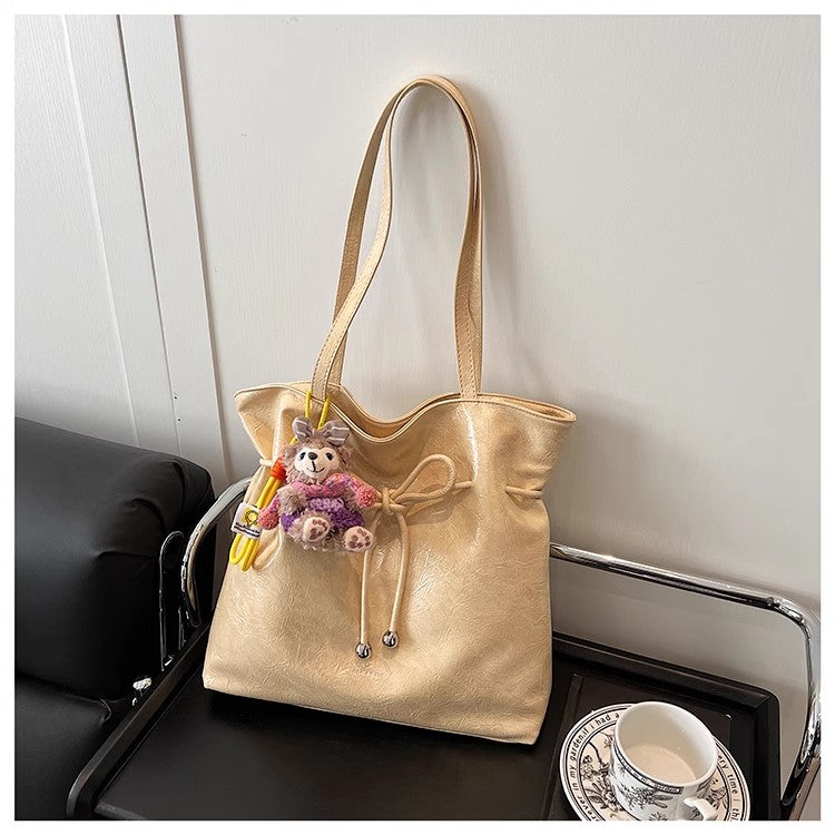 何にでも使えるショルダーバッグが流行で爆発的なトートバッグですThe versatile single-shoulder bag is a popular bestseller, the Tote bucket bag