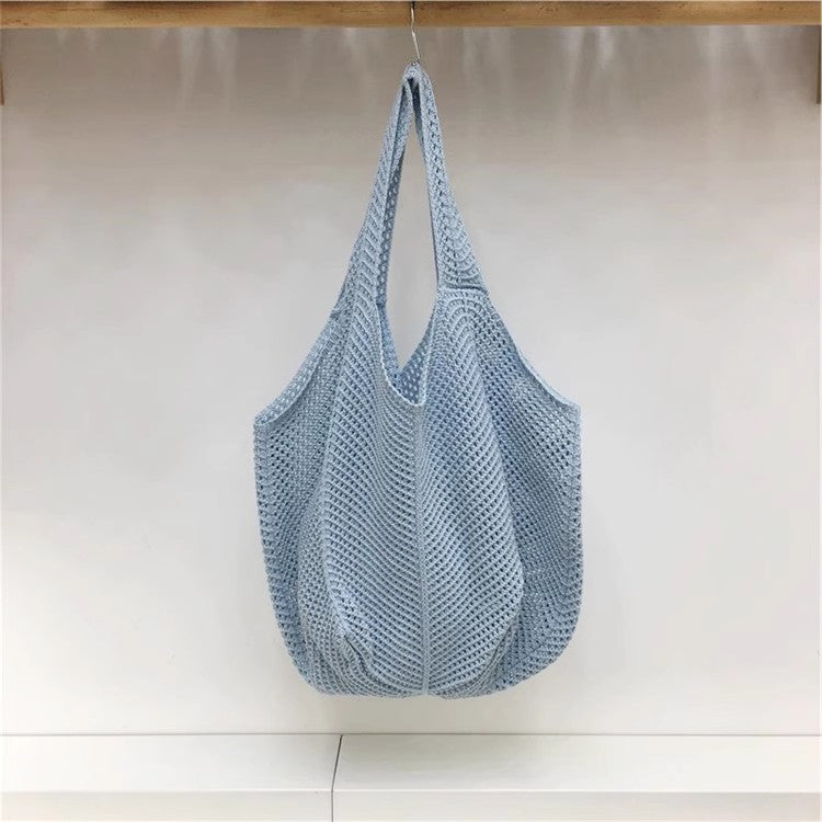 手編みバッグカジュアルな怠惰な風赤い大きなバッグの肩のバッグですHandcrafted hollowed-out woven bag, casual and laid-back style red large single-shoulder bag