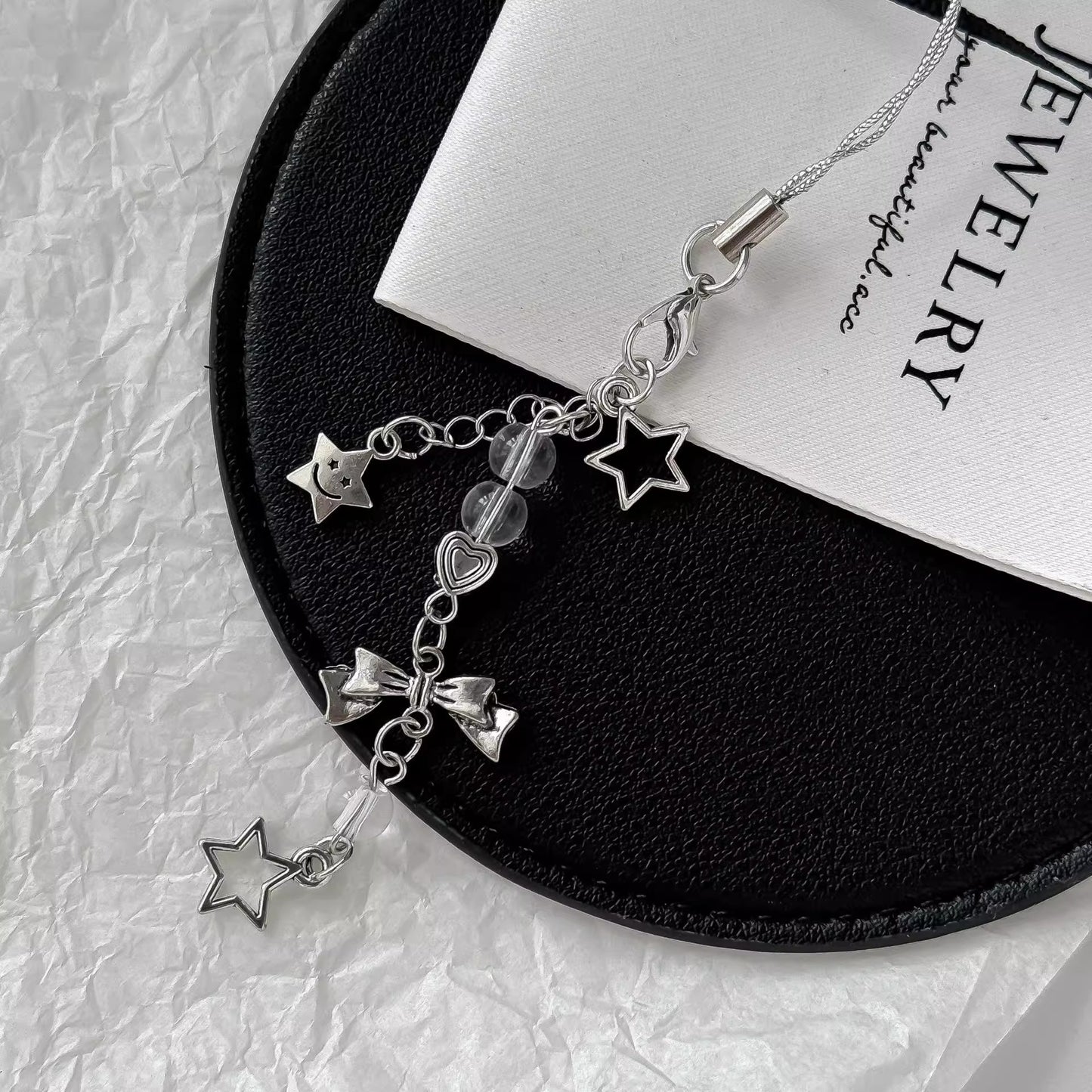 シルバーリボンのストラップですSilver bow pendant