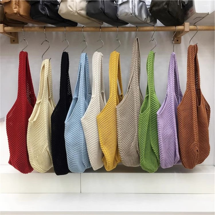 手編みバッグカジュアルな怠惰な風赤い大きなバッグの肩のバッグですHandcrafted hollowed-out woven bag, casual and laid-back style red large single-shoulder bag
