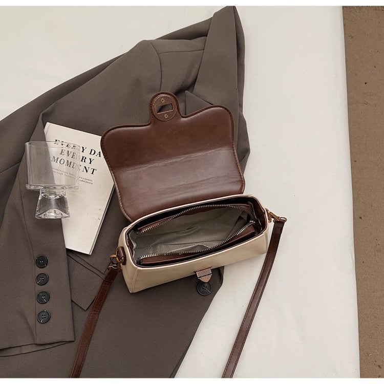 サンロックハンドバッグカジュアルコーディネートのワンショルダーバッグですFashionable lock button handbag, casual and versatile single-shoulder crossbody bag