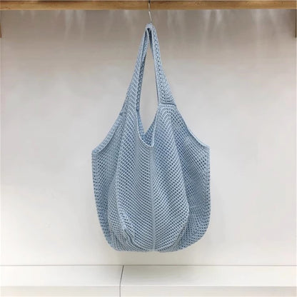 手編みバッグカジュアルな怠惰な風赤い大きなバッグの肩のバッグですHandcrafted hollowed-out woven bag, casual and laid-back style red large single-shoulder bag