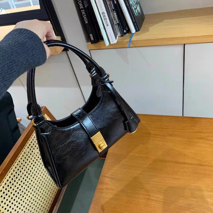カジュアルな質感のショルダーバッグのおしゃれで優雅な女性のバッグをかけますCasual, versatile, high-quality crossbody bag, fashionable and elegant women's bag