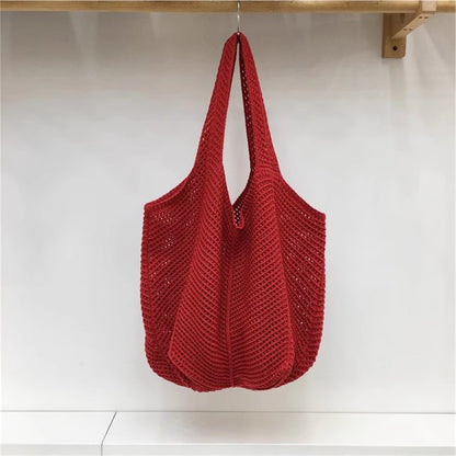 手編みバッグカジュアルな怠惰な風赤い大きなバッグの肩のバッグですHandcrafted hollowed-out woven bag, casual and laid-back style red large single-shoulder bag