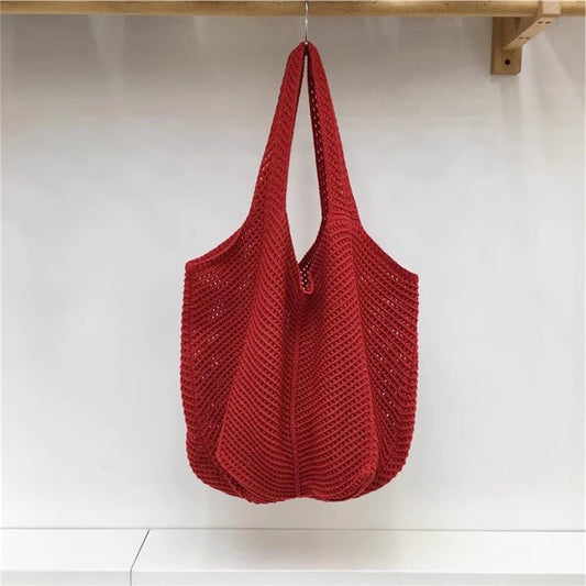 手編みバッグカジュアルな怠惰な風赤い大きなバッグの肩のバッグですHandcrafted hollowed-out woven bag, casual and laid-back style red large single-shoulder bag